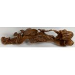 A highly carved wooden Chinese Ruyi sceptre with floral and bat detail. Approx. 38cm long x 9cm