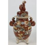 A vintage Japanese satsuma wear ceramic Koro with Foo dog handles and finial to lid. Painted