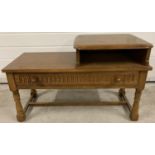 A vintage Priory wooden telephone table/seat. Front draw with carved detail and turned legs. Approx.