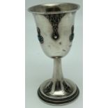 A vintage 925 silver stemmed kiddush cup with filigree detail and set with blue glass cabochons.