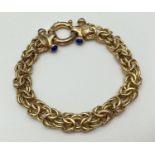 A silver gilt Byzantine chain bracelet with large spring clasp and lapis lazuli set fixings, by Brev