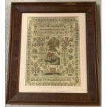 A framed and glazed Georgian sampler with religious verse, floral border & griffin and house detail,