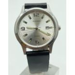 A men's Sekonda wristwatch with stainless steel case and black leather strap. Silver tone face