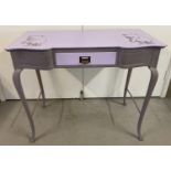 A vintage wooden console table/desk, painted in lilac tones and with Winnie-the-Pooh stencilled