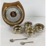 A set of 4 matching A1 silver plated salts with decorative scroll detail, raised on tripod ball