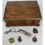 A vintage brass bound and inlaid wooden slope topped box with contents. To include a sterling silver