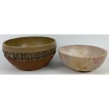 A vintage stone ware bowl with embossed letter and number decoration. Base marked TM 7/73.