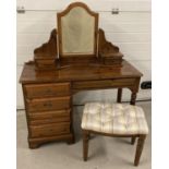 A modern Ducal Ltd "Hampshire" pine 5 drawer dressing table with matching stool and mirrored top.
