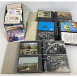 A box containing a large quantity of amateur radio QSL cards and albums of modern postcards.