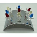 A Swarovski Crystal Society set of 9 coloured crystal miniature tulips, complete with display stand.
