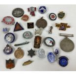 A small collection of vintage pin badges, brooches and medallions. To include: WWII war medal, Royal