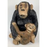 A large 28" painted fibreglass figure of a chimpanzee and her young.