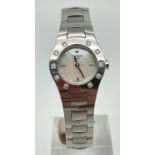 A ladies silver tone bracelet strap wrist watch by Tissot. Crystal set case with mother of pearl