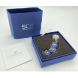 A boxed 2011 Swarovski Crystal Society pale lilac "Artic Flower" window/hanging crystal light