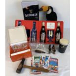 A collection of vintage Guinness collectables and memorabilia. To include Guinness bottle wooden