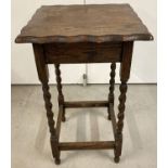 A vintage oak hall/occasional table with barley twist legs, square shaped top and pie crust edge.