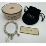 A Links Of London Sweetie bracelet with 3 charms. bracelet marked with Links of London name and