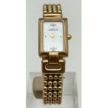 A gold tone popcorn style bracelet strap ladies wrist watch by Michel Herbelin. Mother of pearl