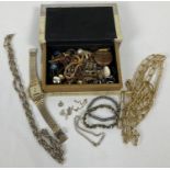A box of vintage and modern costume jewellery to include necklaces, bracelets and earrings.