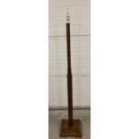An Art Deco wooden standard lamp with square column detail and stepped base. Total height