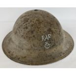 A British 1940 WWII MkII steel helmet with painted RAF monogram & badge to front. With traces of