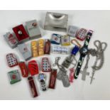 A box of assorted misc items, mostly smoking related items. To include: lighters, keyrings,