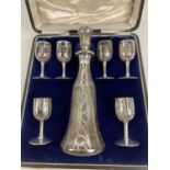 An Art Nouveau glass liqueur decanter and 6 matching glasses with sterling silver overlay. Each