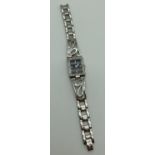 A ladies stainless steel bracelet wristwatch by Guess. Square case set with small crystals. Black