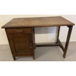 A vintage 1940's dark oak framed Utility desk with single drawer and cupboard. Approx. 70cm tall x