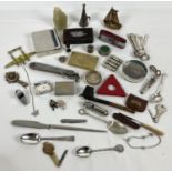 A small collection of assorted vintage items. To include: penknives, whistles, teaspoons, clay