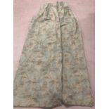 A pair of heavy lined curtains in a duck egg blue with a brown and beige floral pattern. Approx. 138