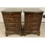 A pair of reproduction dark wood bow fronted chests. Each with 4 drawers, drop down brass handles