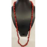 A 33" coral chip costume jewellery necklace.