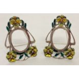 A pair of Art Nouveau style, 925 silver, miniature picture frames with enamelled flower detail.