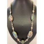 A 24" costume jewellery necklace made from abalone shell, green agate and white metal beads.