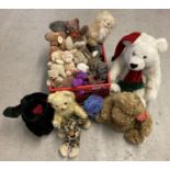 A collection of vintage and modern soft toys. To include teddy's, elephants, rabbit and dogs.