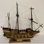 A handmade wooden scale model of a 16th century galleon with 20 guns.
