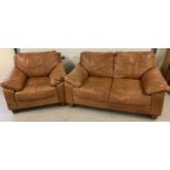 A modern design 2 seater tan leather sofa and matching armchair with square wooden feet.