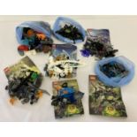 A collection of assorted Lego Bionicle play pieces and instructions.