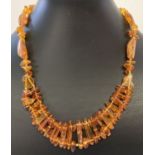 An 18 inch amber necklace made from varying sized pieces of amber, with screw barrel clasp.