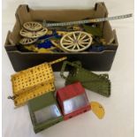 A box of assorted vintage Meccano. To include wheels and plates in varying sizes.