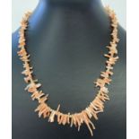 A vintage 18 inch branch coral necklace with spring style clasp.