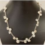 A keshi pearl and faceted glass bead necklace with 925 silver S shaped clasp.
