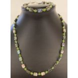 A matching abalone and crystal beaded necklace and bracelet.