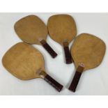 A set of four vintage wooden Slazenger Padders tennis bats. …