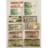 A collection of 12 assorted foreign bank notes. To include: Singapore, South Africa, Bolivia, Jam…