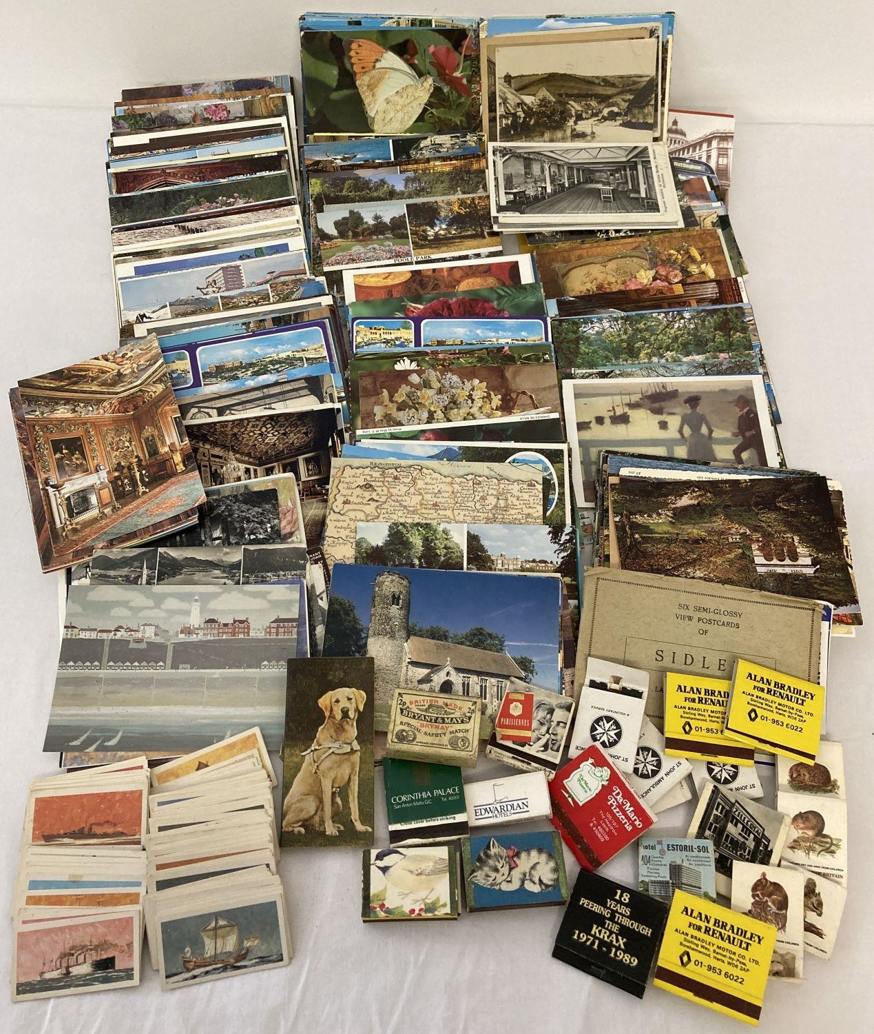 A shoe box of assorted vintage ephemera to include a quantity of assorted postcards, matchboxes a…