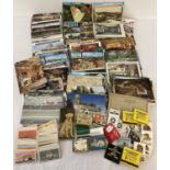 A shoe box of assorted vintage ephemera to include a quantity of assorted postcards, matchboxes a…