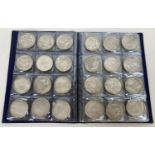 A folder containing 72 assorted white metal coins from around the world. Folder approx. 21cm x 16…