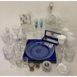 A collection of glass and crystal ware to include twist stem glasses, paperweights and vases. Lot…